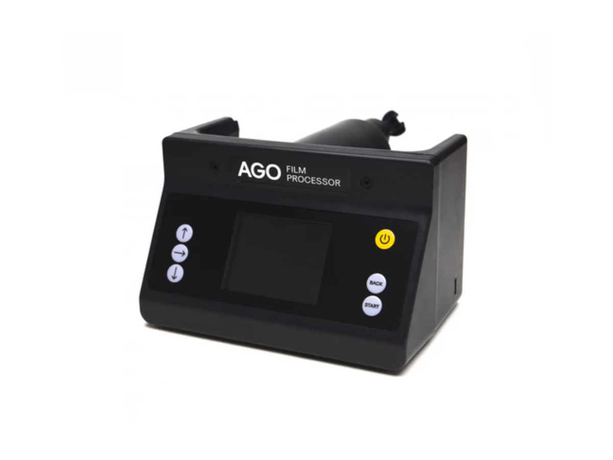 Black AGO film processor on a white background