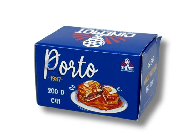 Blue box of Porto 35mm film on a white background with a plate of food showing a Portugese Francesinha sandwich.