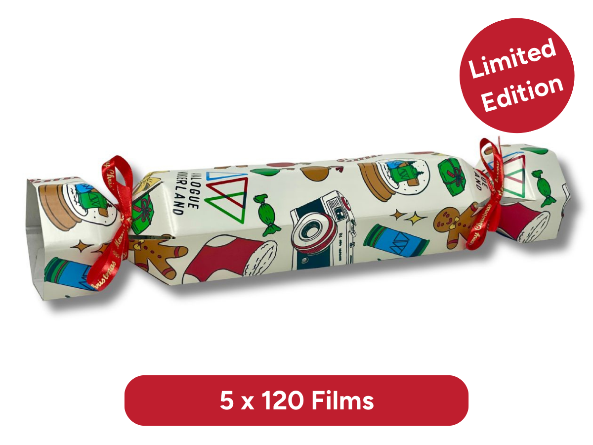 Roll of film with Christmas-themed design and limited edition label on a white background