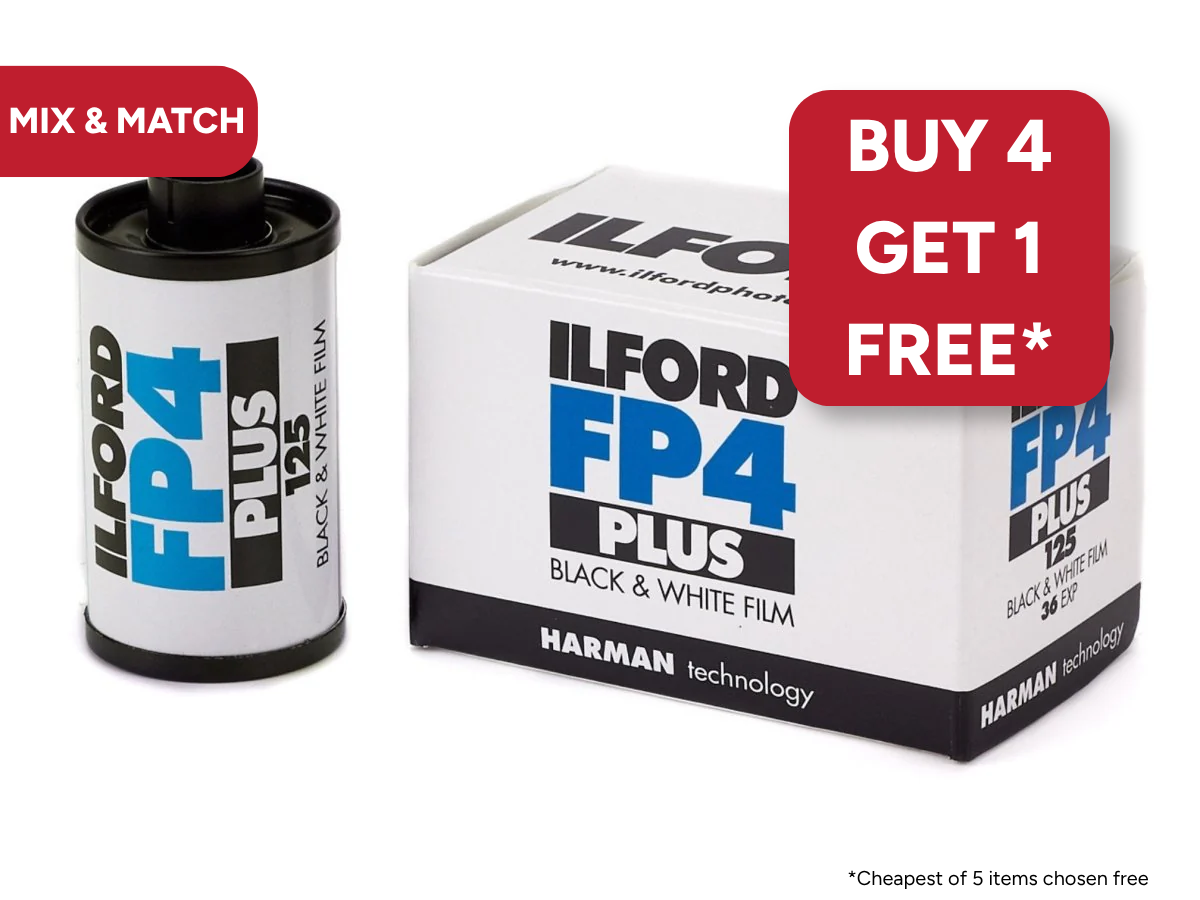 Ilford FP4 Plus black and white film canister and packaging on a white background