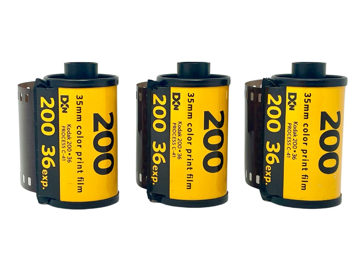Three rolls of 35mm Kodak Gold colour print film with yellow labels on a white background.