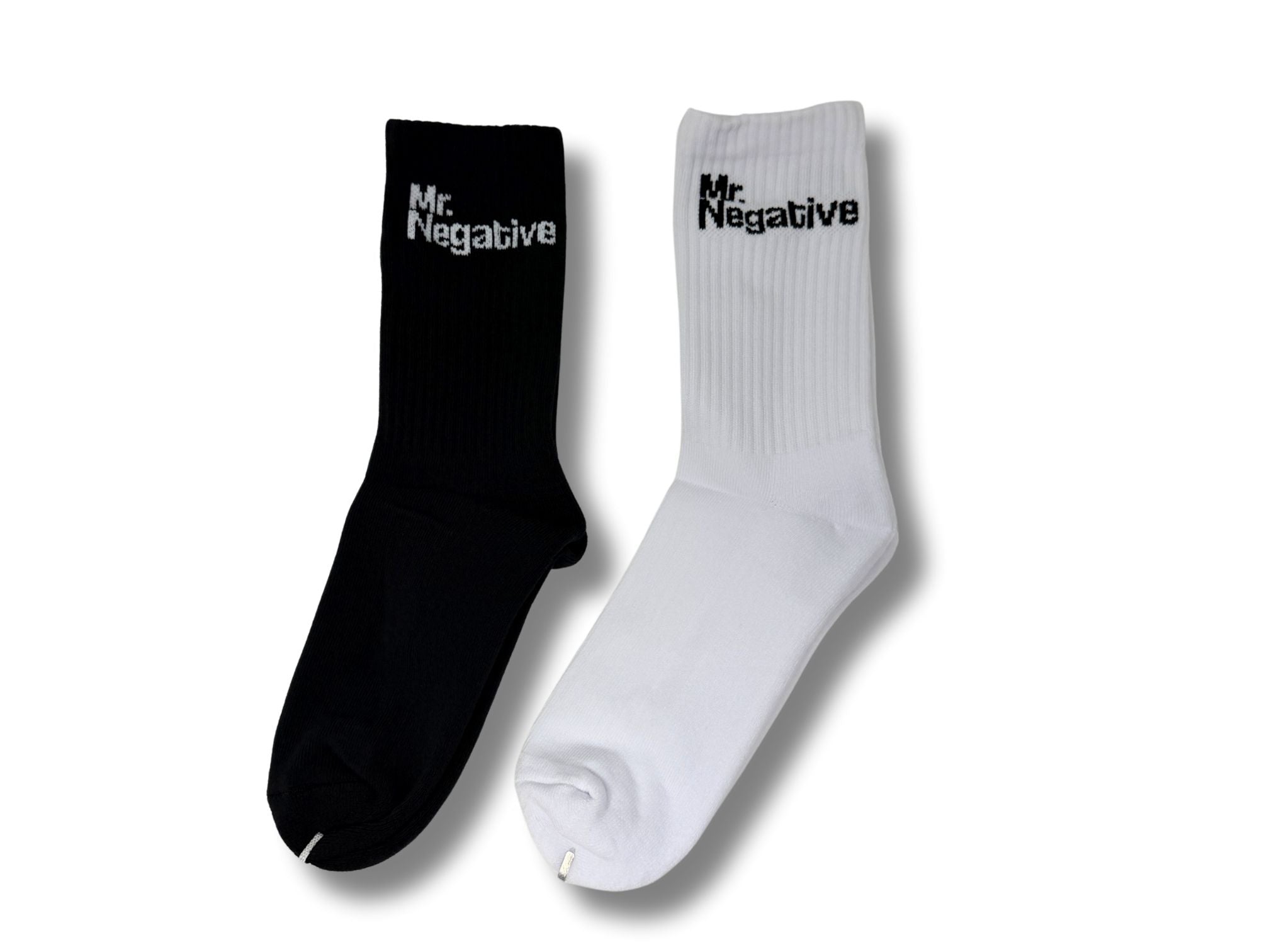 Black and white socks with 'Mr. Negative' text on a white background