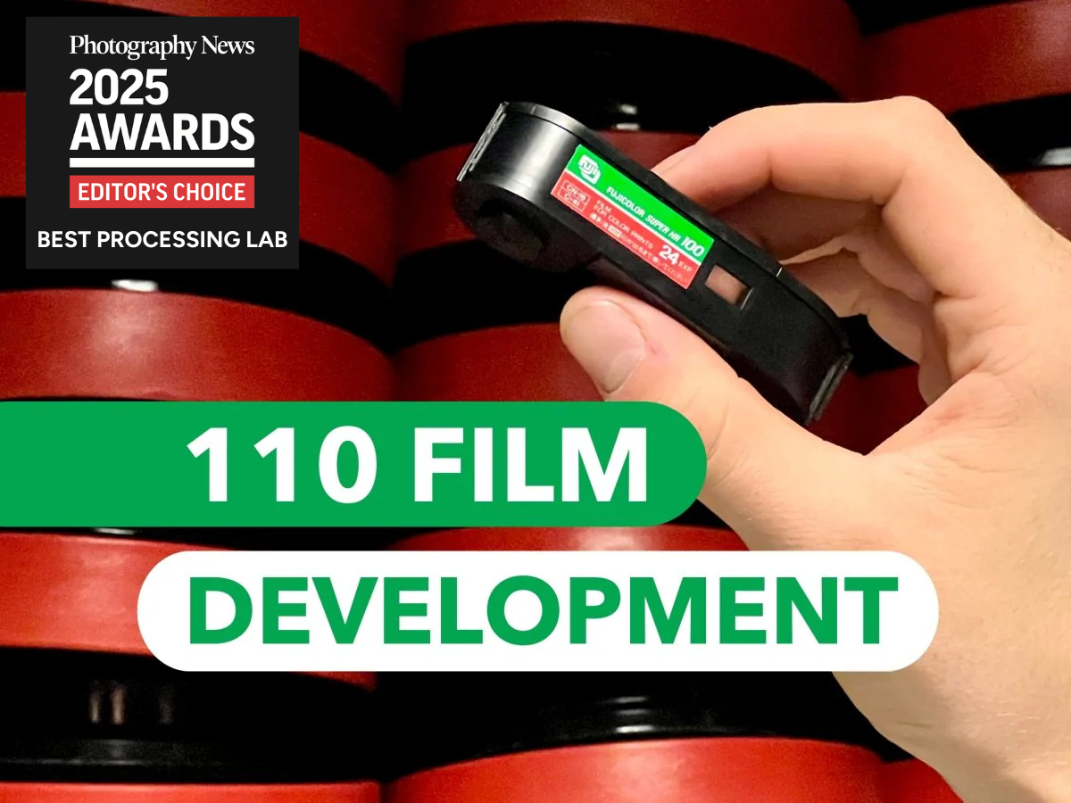 Hand holding a film development device with text about 110 film development and Photography News awards.