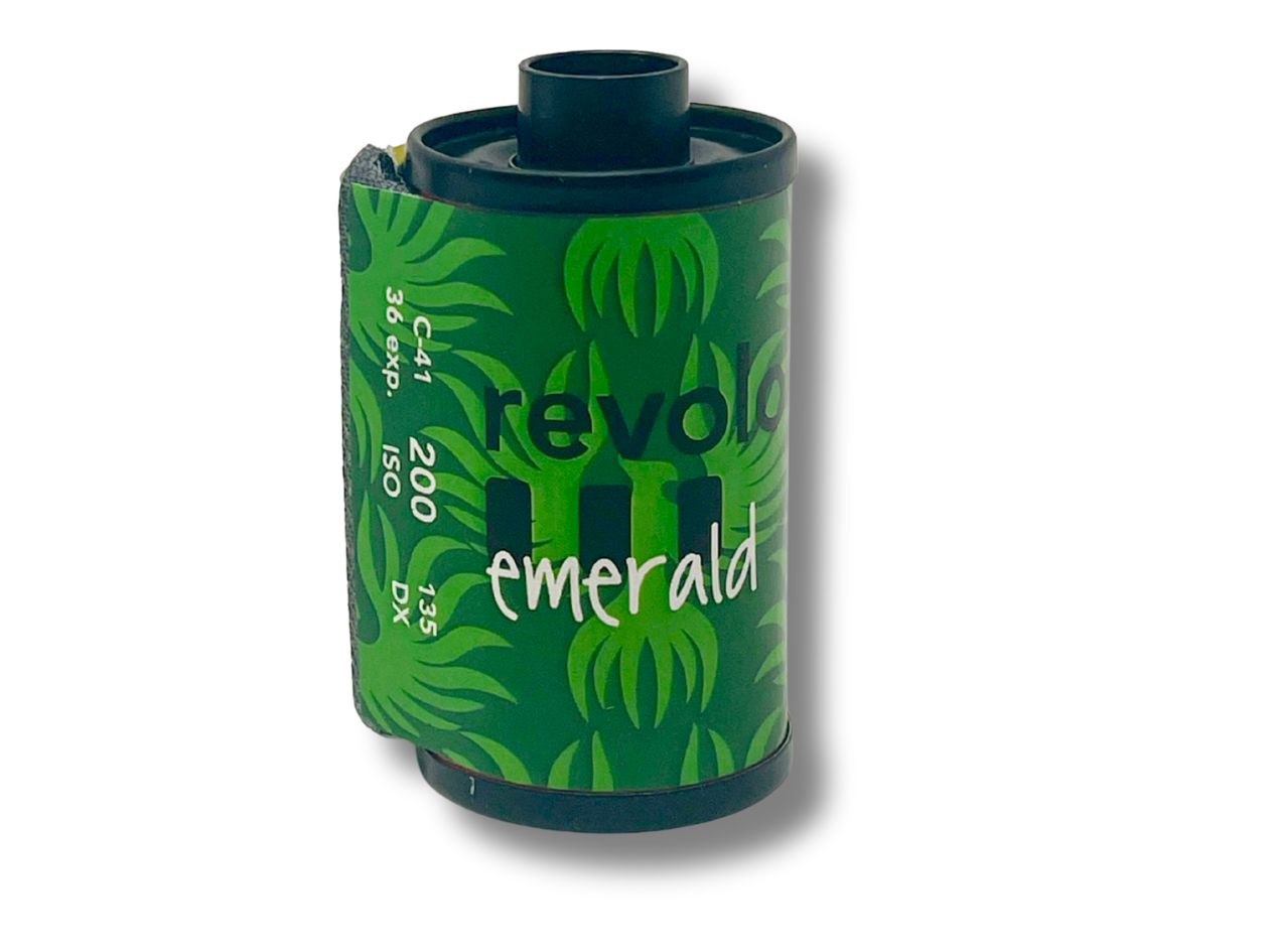 Green film cassette with 'revolog emerald' branding on a white background.