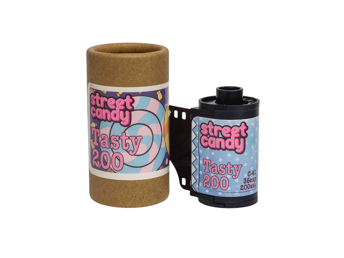 A roll of Street Candy Tasty 200 film shown next to its brown cardboard core on a plain white background.