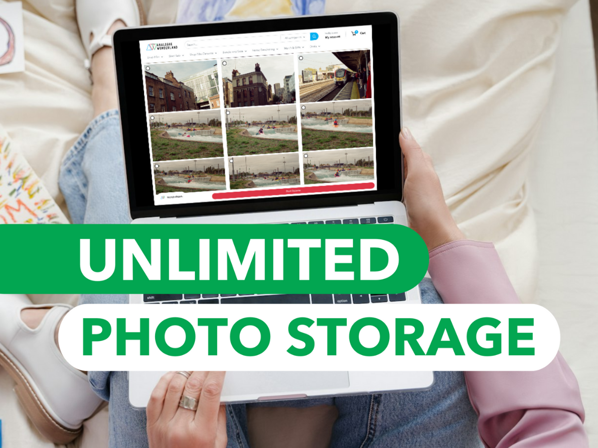 A person holding a tablet with the text 'UNLIMITED PHOTO STORAGE' displayed on it, showcasing a photo storage application interface.