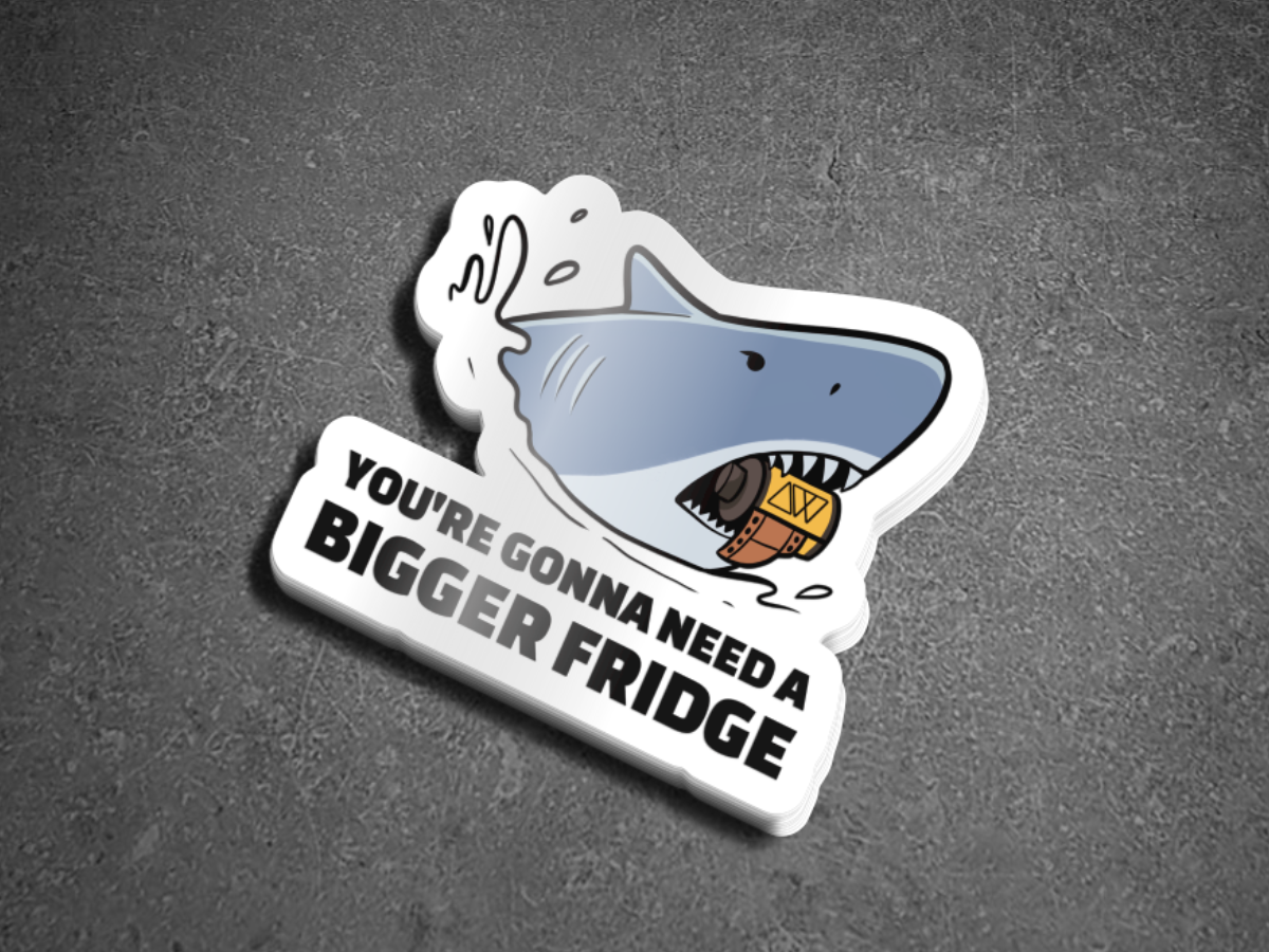 Sticker with a shark design and text on a gray background