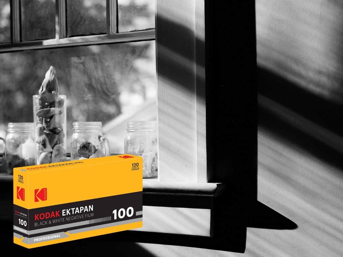 Kodak Extapan 100 film box on a windowsill with jars and plants in the background