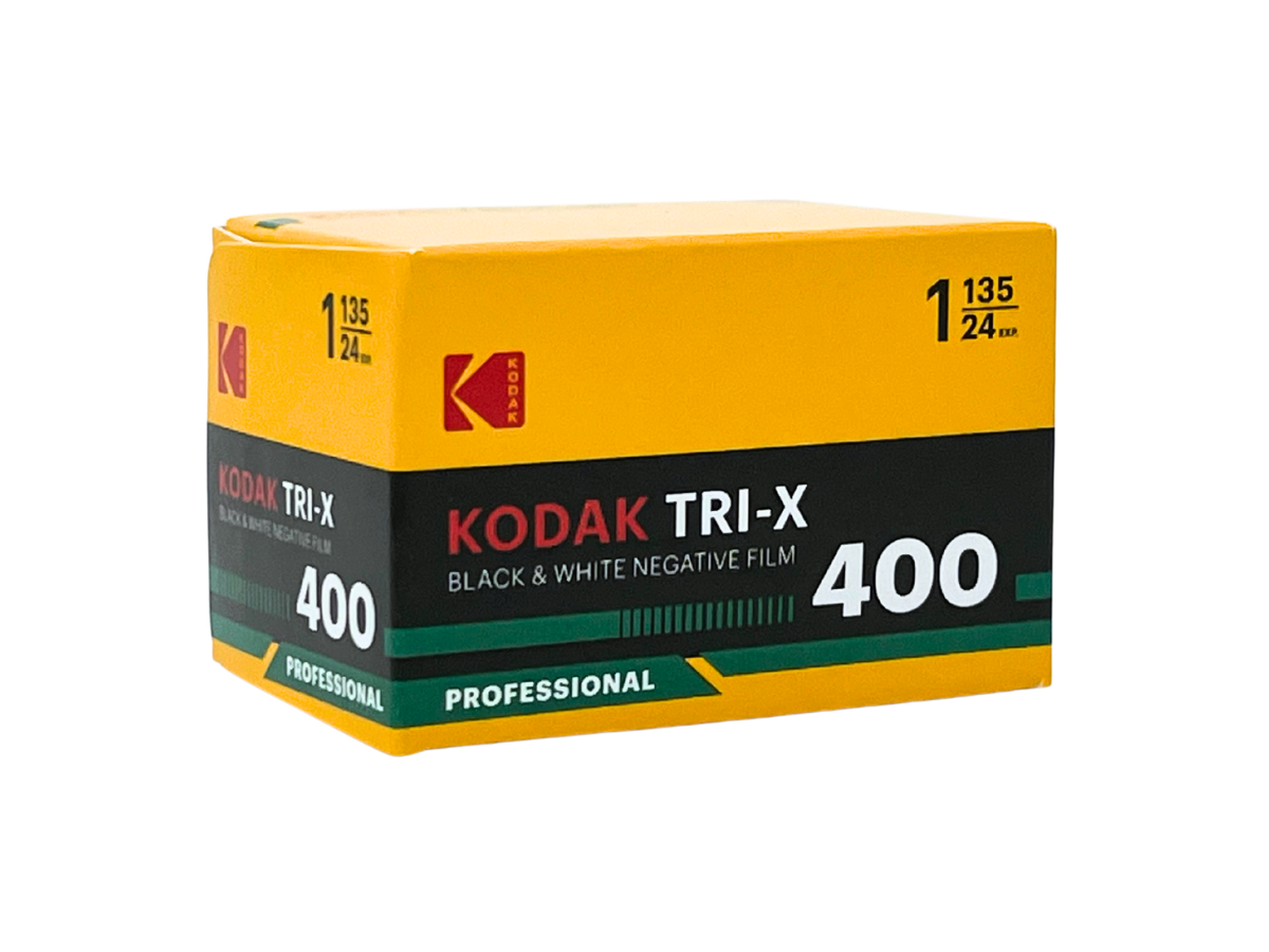 A box of Kodak Tri-X 400 black and white negative film, featuring its signature yellow, black, and green packaging on a plain white background.