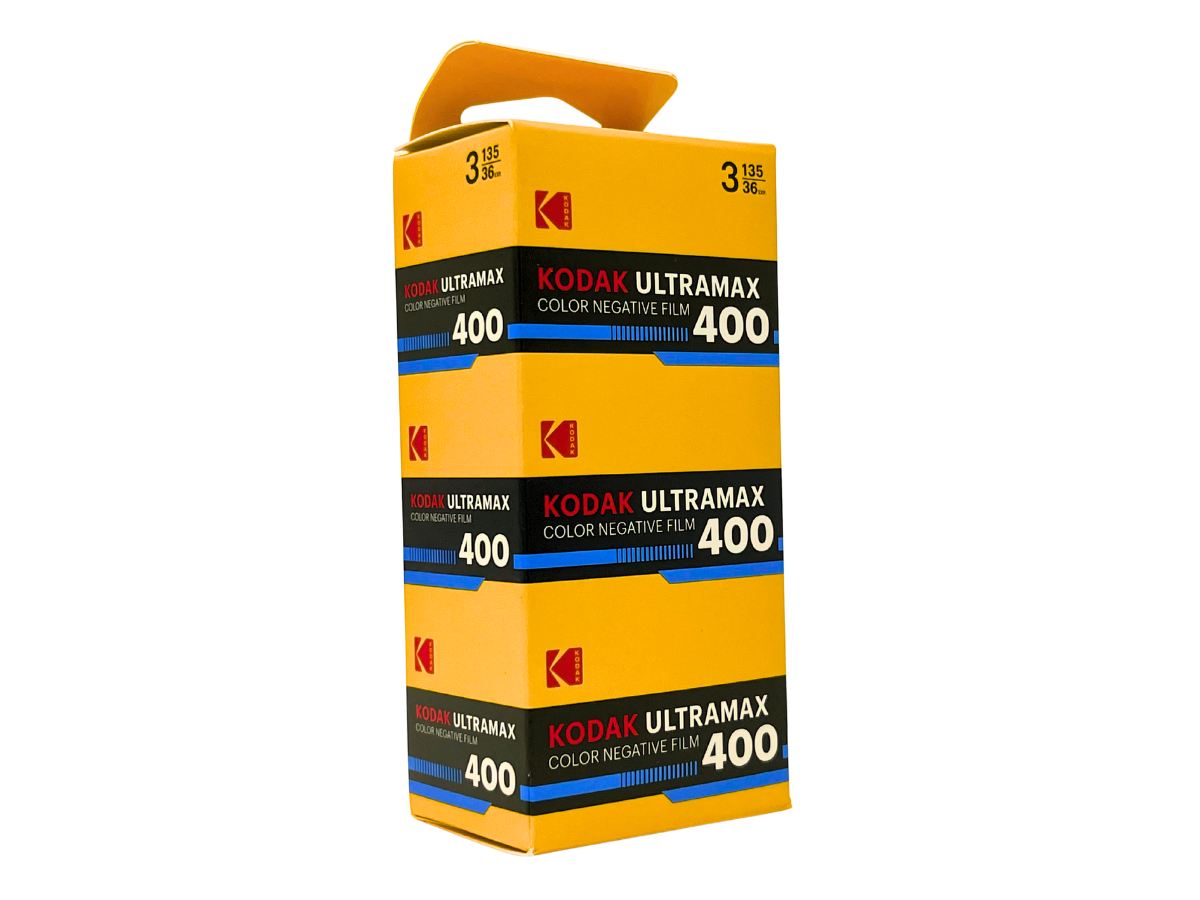 A stack of three Kodak Ultramax 400 color negative film canisters in a bright yellow box with a built-in handle, shown on a plain white background.