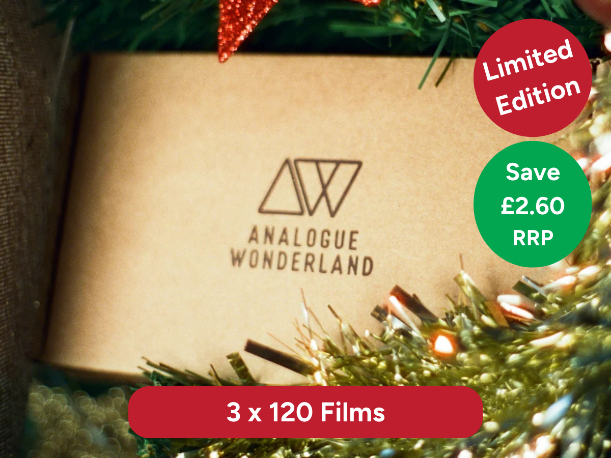 Product packaging with Analogue Wonderland logo and promotional text on a festive background