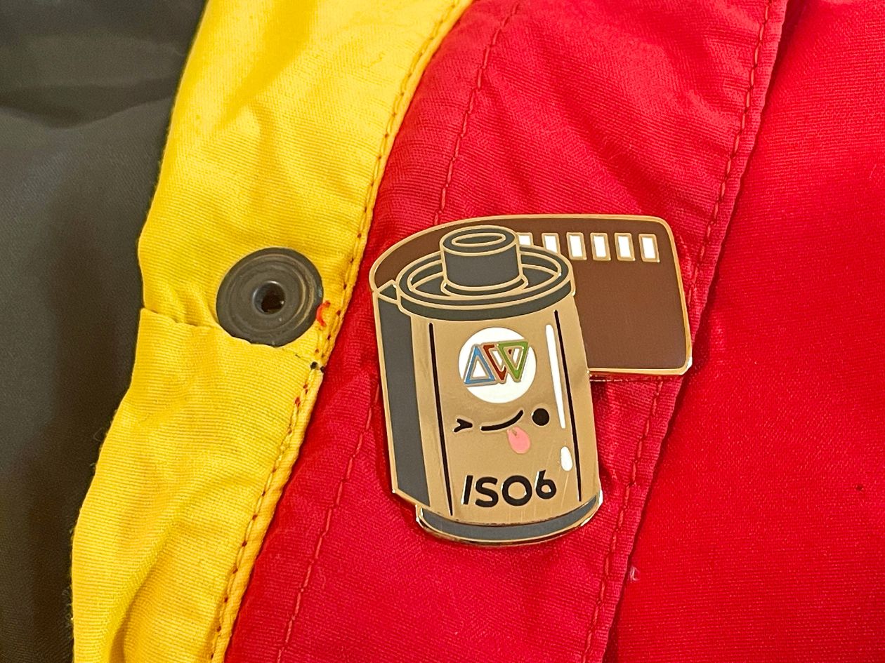 ISO 6 Film Cassette - Enamel Pin - Pinned to Coat