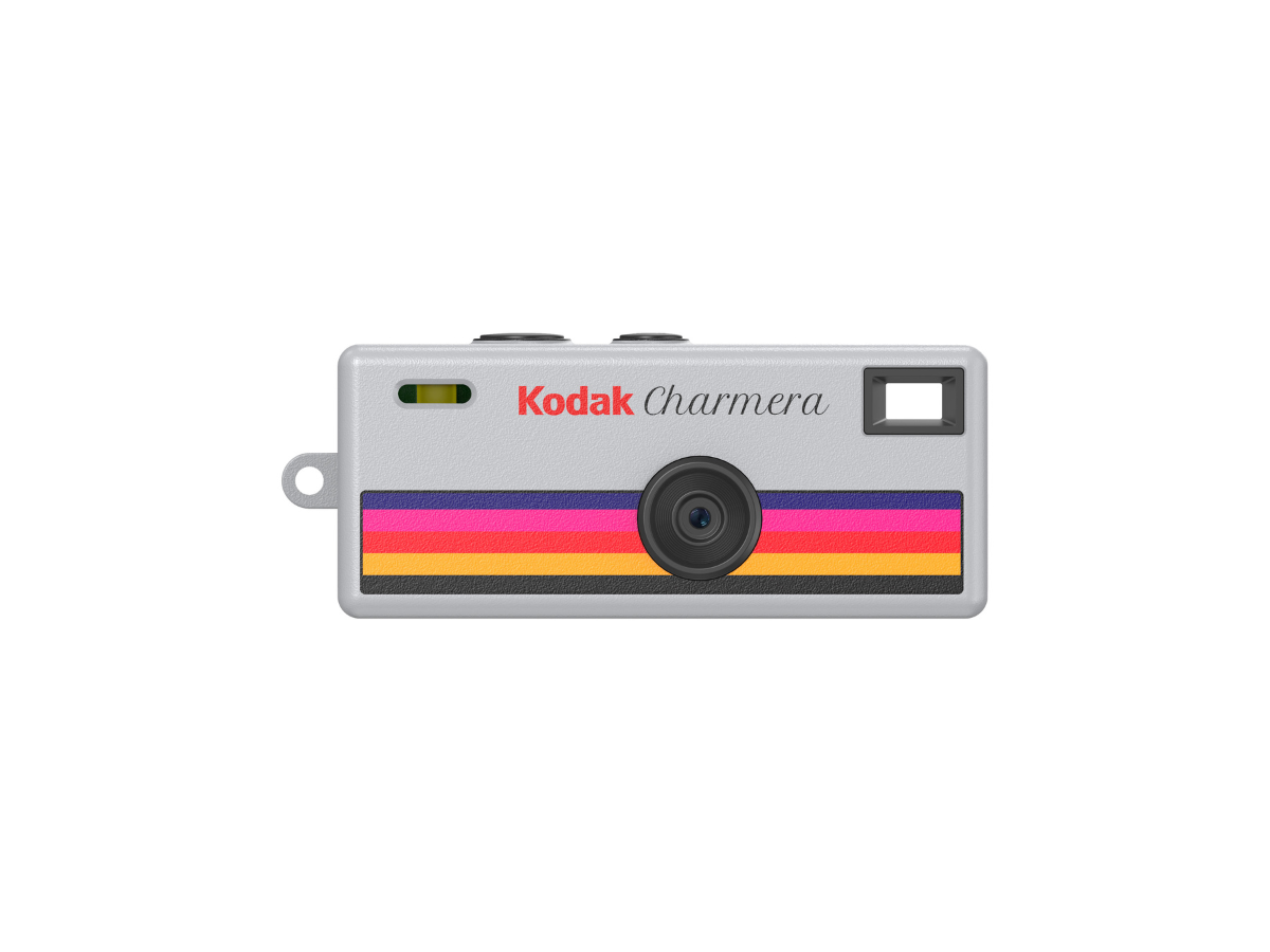 Grey Kodak Charmera camera with colorful stripe on a white background