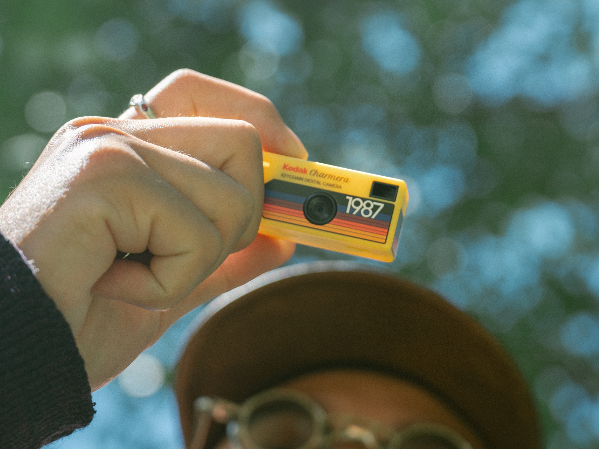 Sample Image | Hand holding a yellow Kodak Charmera with a blurred background
