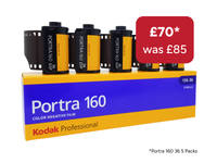 A box of Kodak Professional Portra 160 color negative film showing five rolls of film partially unboxed above the packaging, with a red price badge reading £70* was £85.