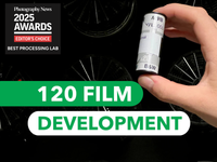 Hand holding a 120 film canister with text about 120 film development and an award logo.