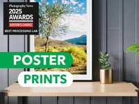 Poster print of a landscape with 'Photography News 2025 Awards' text overlay on a wall.