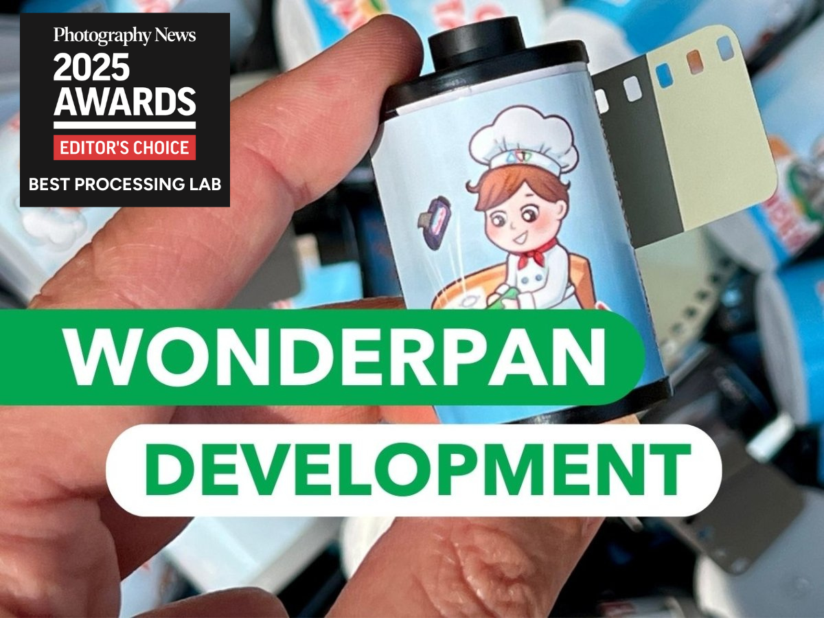 Film canister with cartoon character on a blurred background, featuring 'Wonderpan Development' and 'Photography News 2025 Awards'.