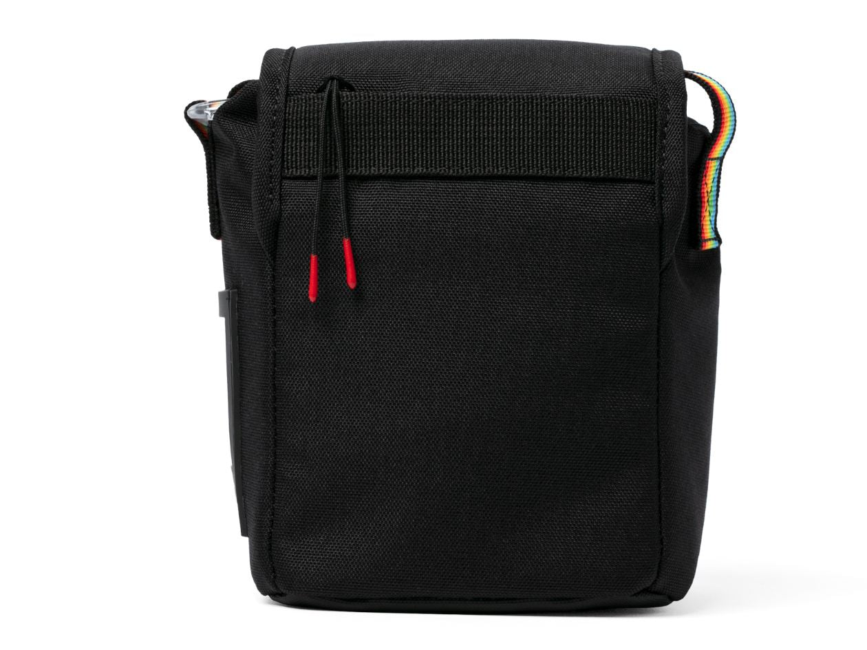 Black bag with colourful strap on a white background.