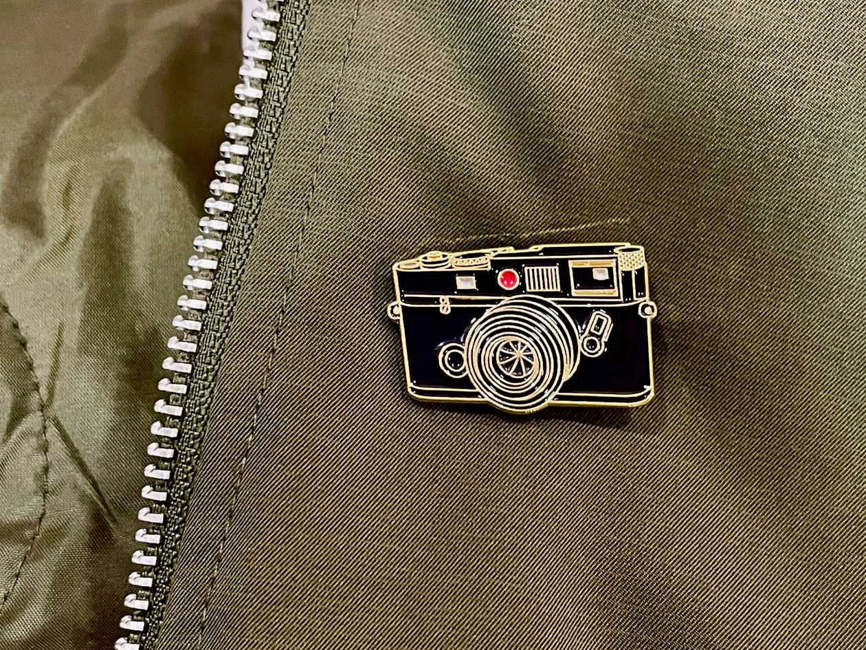 Rangefinder Film Camera - Enamel Pin - Gold on Jacket