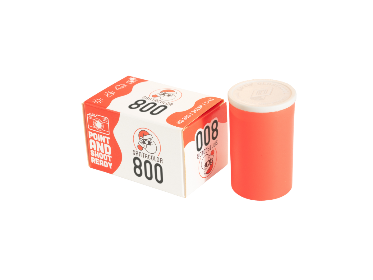 Red roll of film and its packaging on a white background