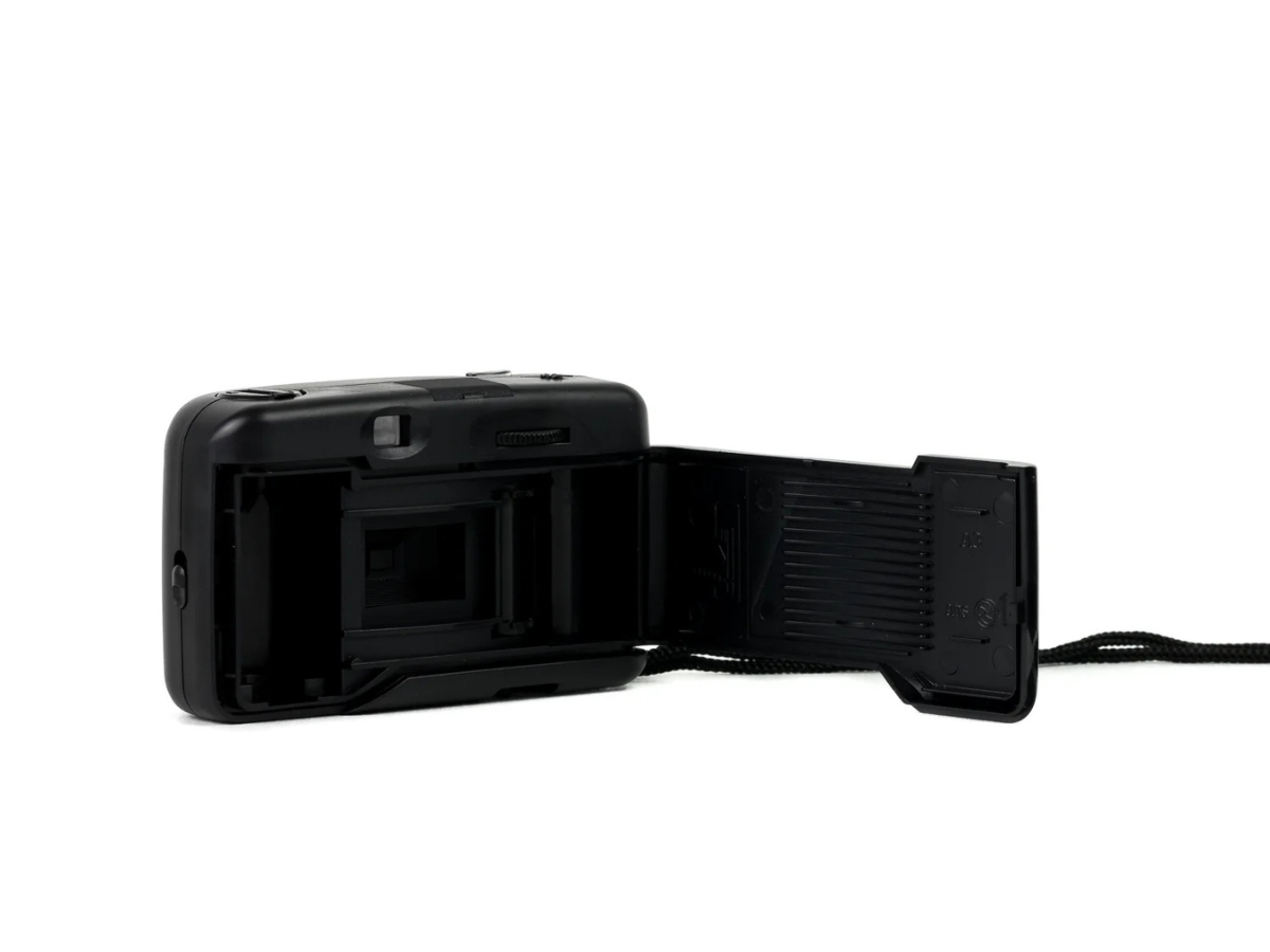Black camera with a screen and control panel on a white background